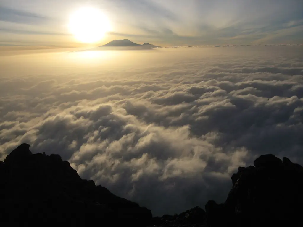 Dawn over a sea of cloud, with Kilimanjaro on the horizon