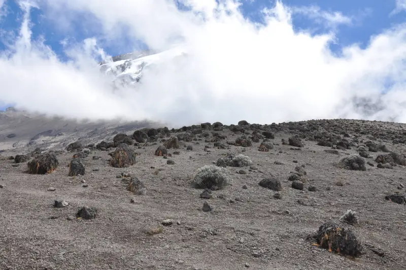Bare volcanic scree of the alpine desert under cloud