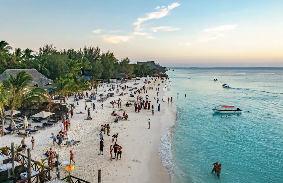 Nungwi beach at golden hour with boats on turquoise water